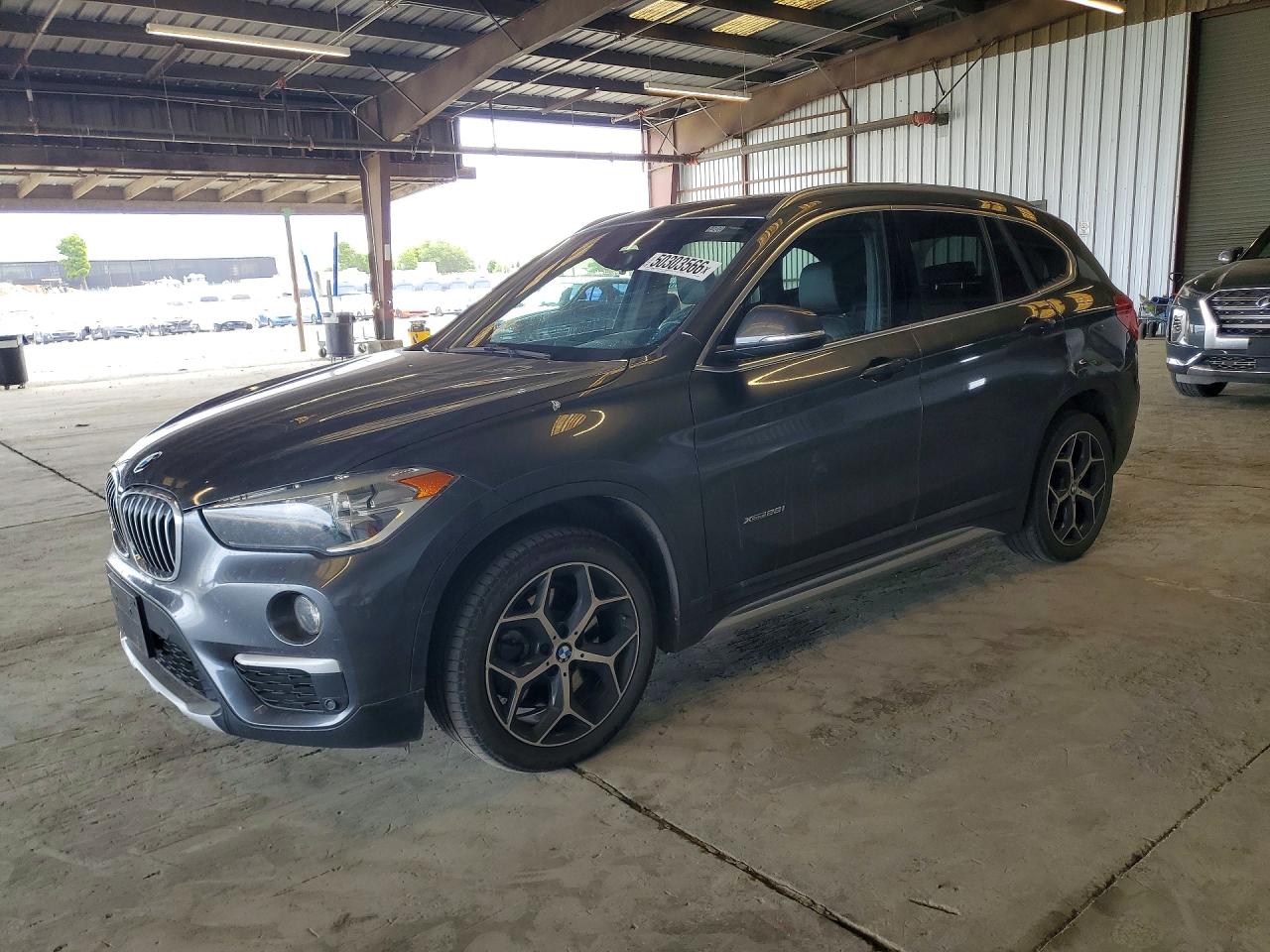 2018 BMW X1 xDrive28i, VIN WBXHT3C30J5K31053 — Rear end