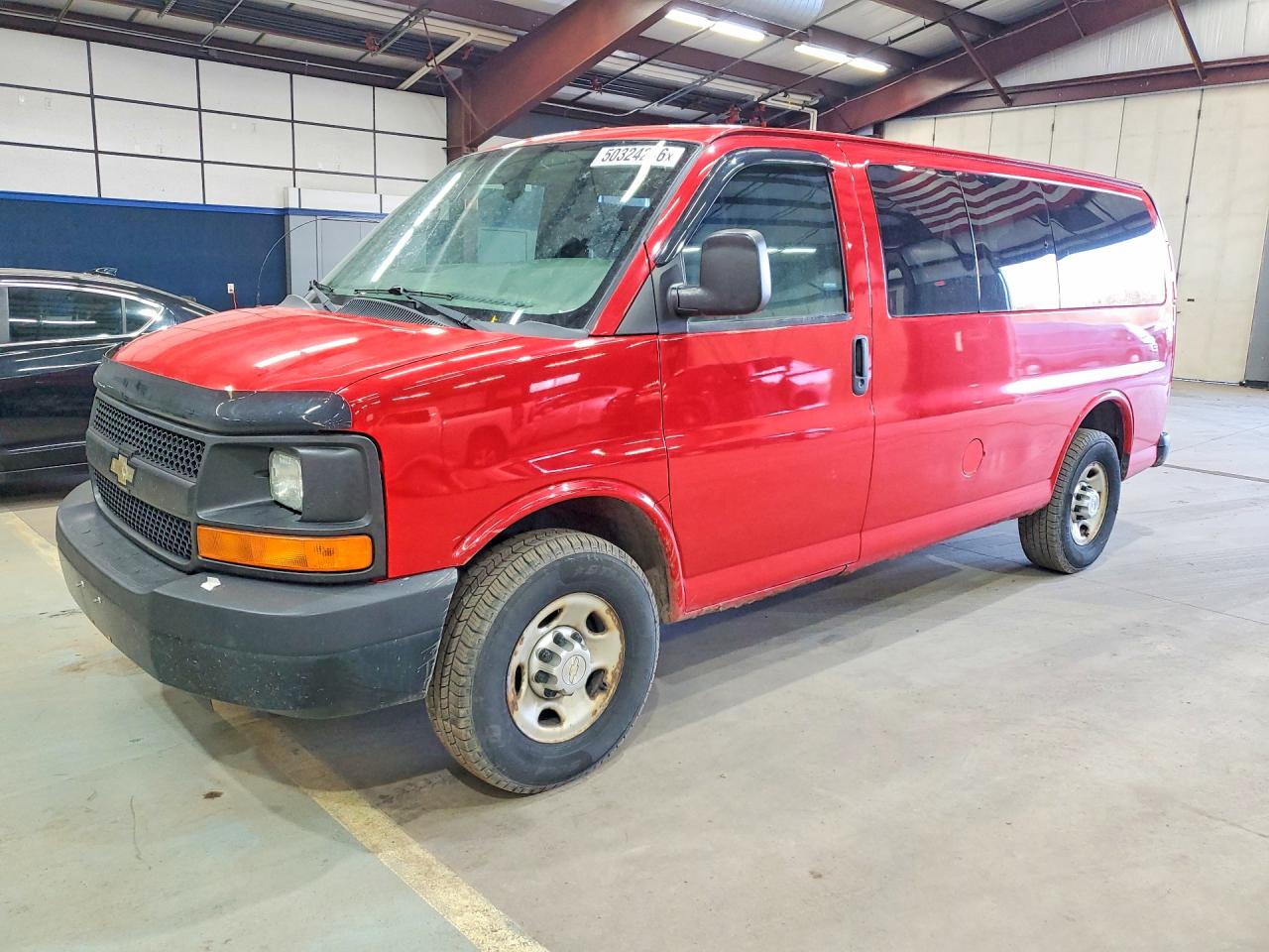 2012 Chevrolet Express Passenger 1LS, VIN 1GAWGPFG4C1197426 — Side