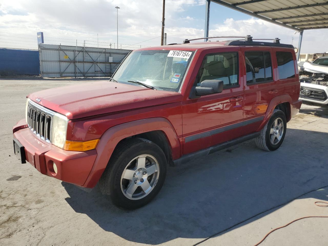 2009 Jeep Commander Sport, VIN 1J8HH48K99C555350 — Minor dents and scratches