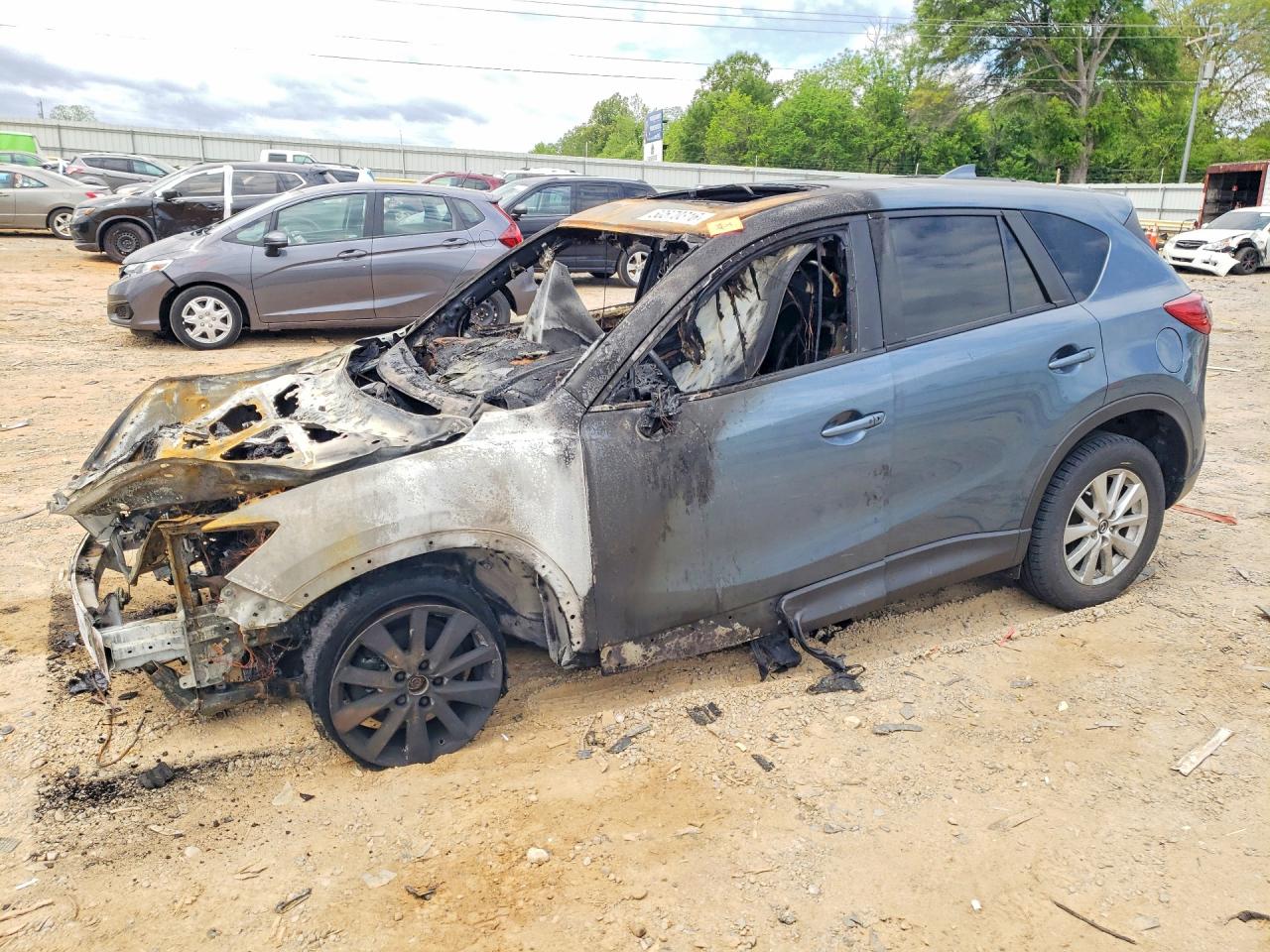 2016 Mazda CX-5 Touring, VIN JM3KE4CY8G0760942 — Burn