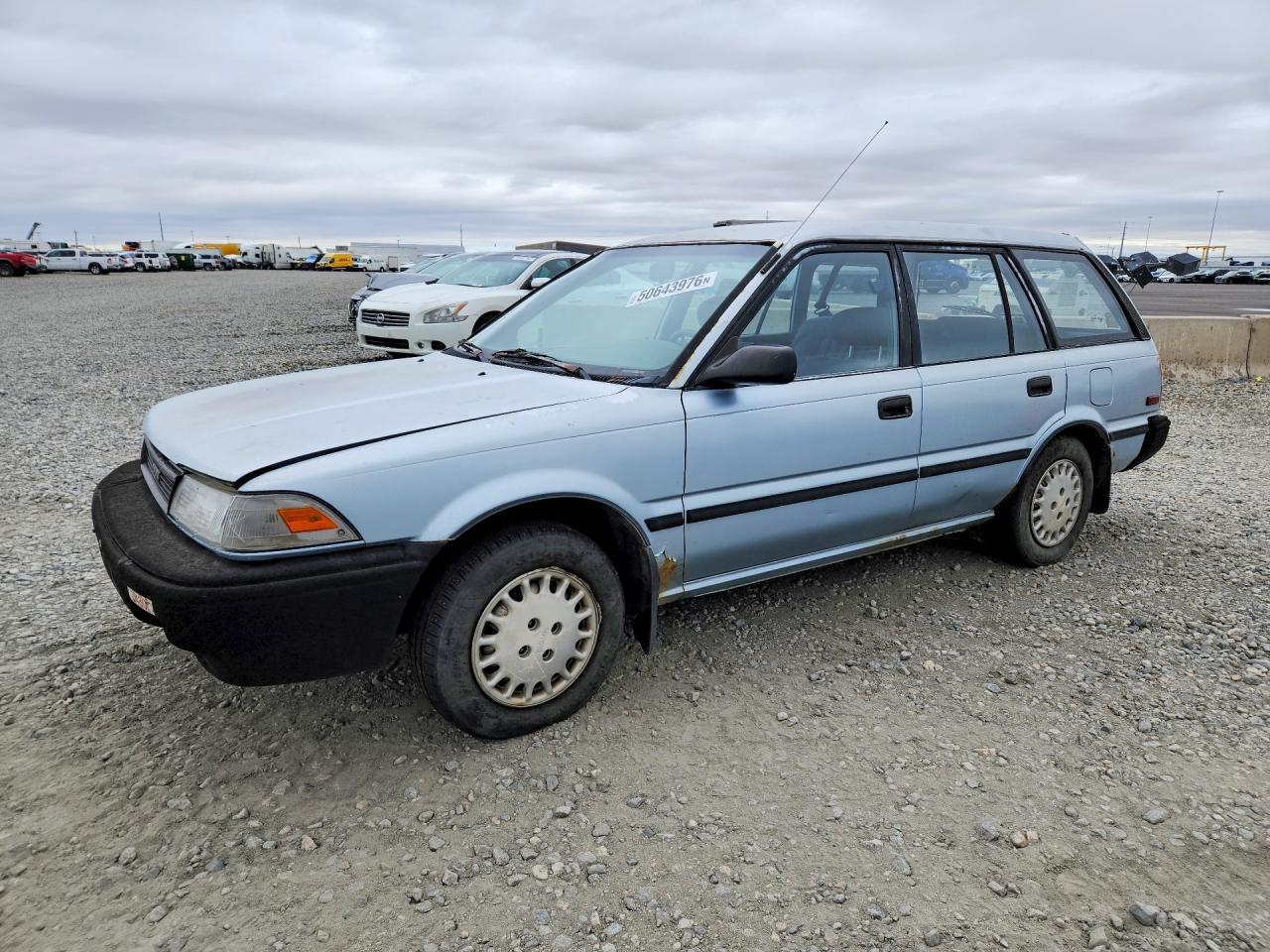 1990 Toyota Corolla, VIN JT2AE94K9L3371157 — Side