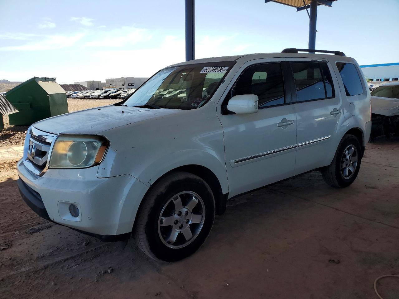 2011 Honda Pilot Touring, VIN 5FNYF3H98BB052003 — Мелкие вмятины и царапины