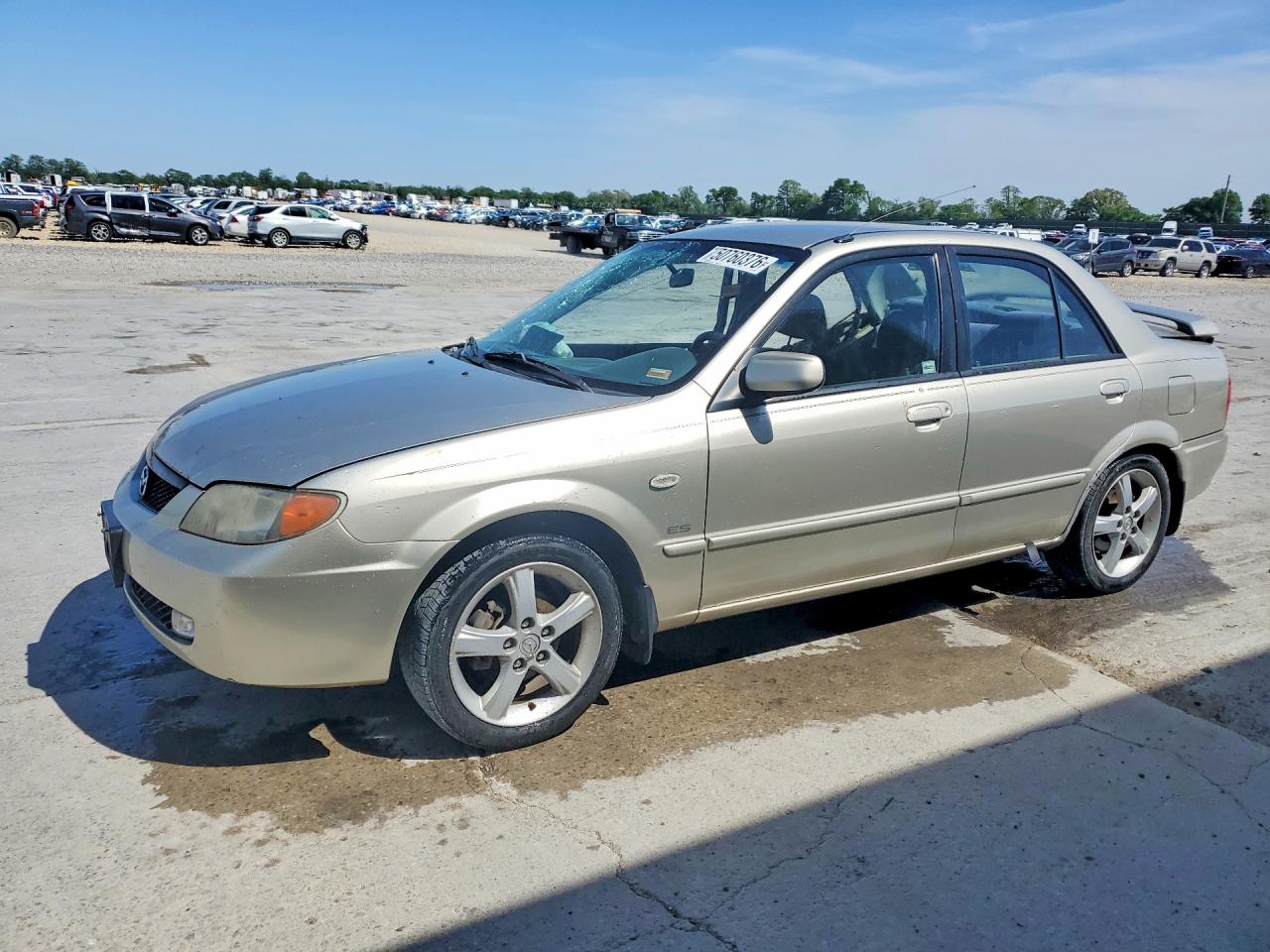 2003 Mazda Protege DX, VIN JM1BJ225131110872 — Бок