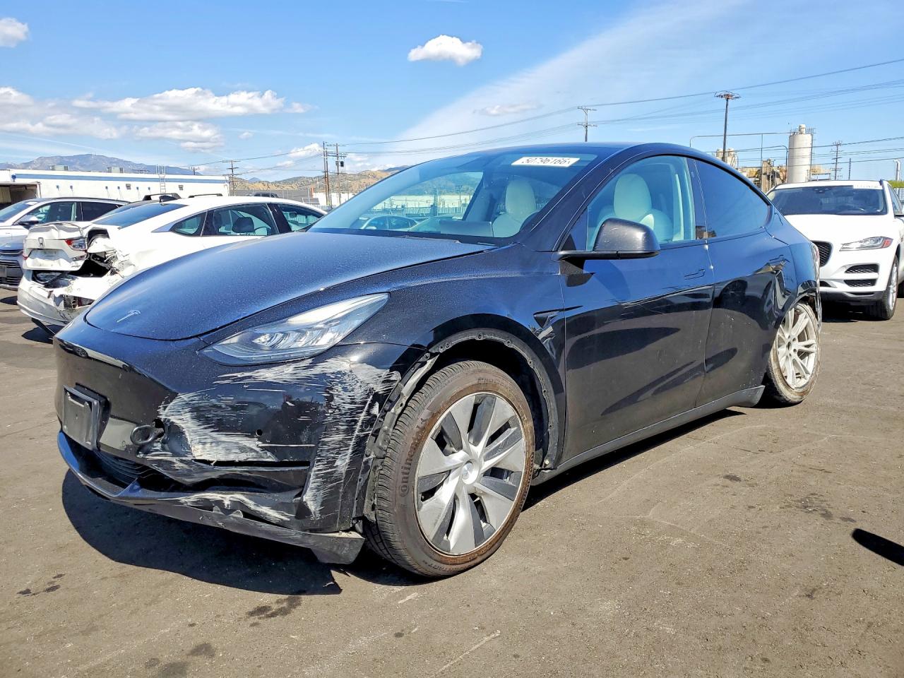 2021 Tesla Model Y Long Range, VIN 5YJYGDEE6MF144802 — Side