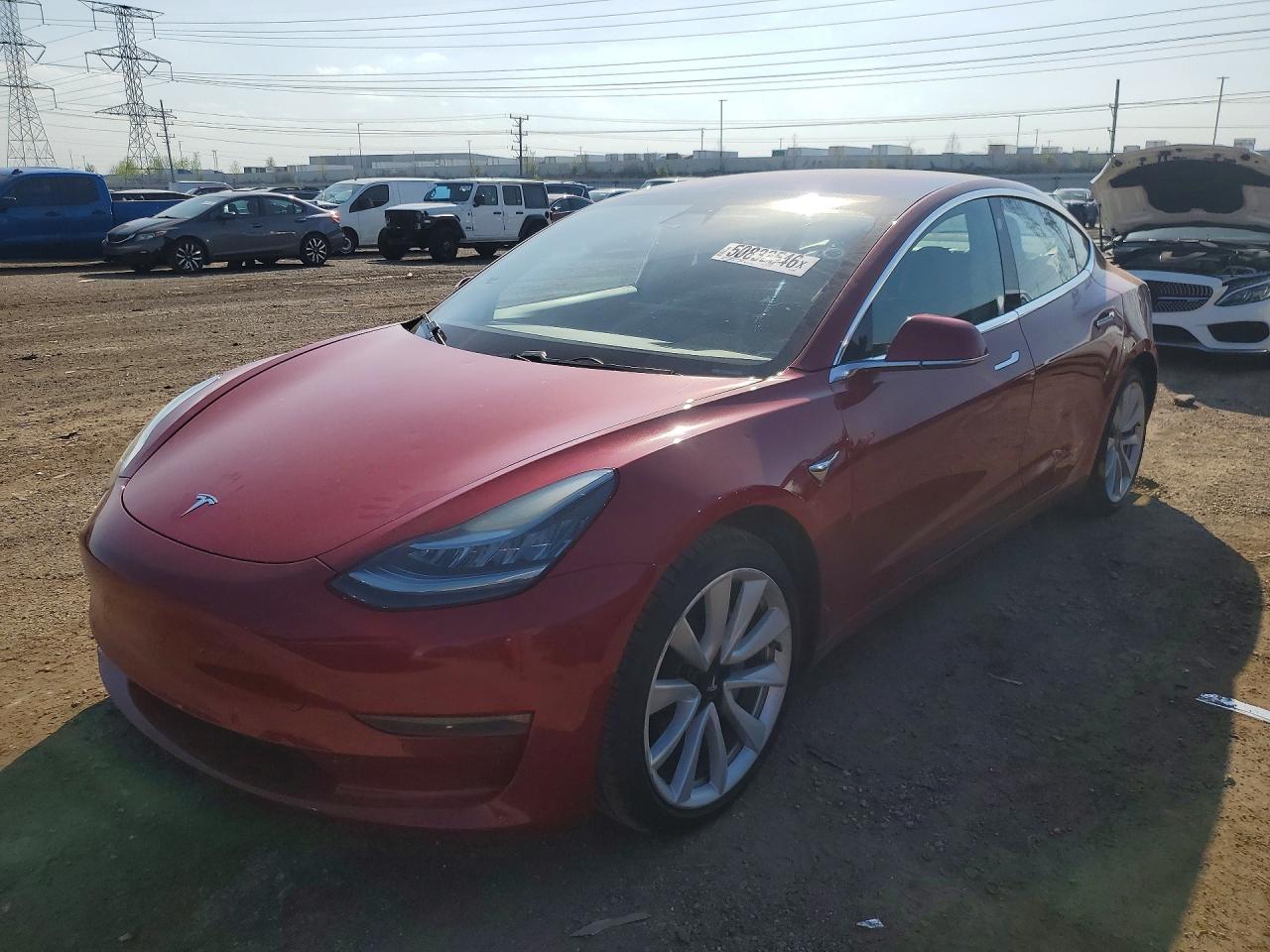 2017 Tesla Model 3 Standard, VIN 5YJ3E1EA1HF000995 — Бок