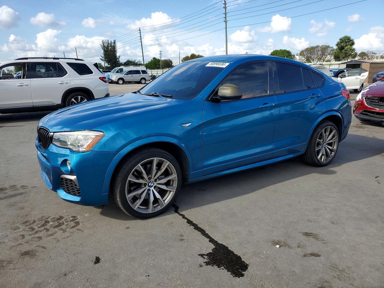 2017 BMW X4 M40i, VIN 5UXXW7C32H0U26262 — Side