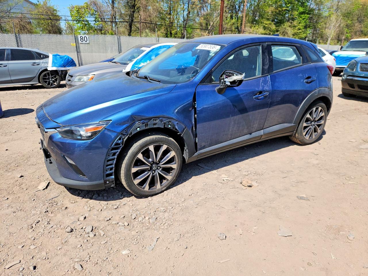 2019 Mazda CX-3 Touring, VIN JM1DKFC71K0403186 — Side