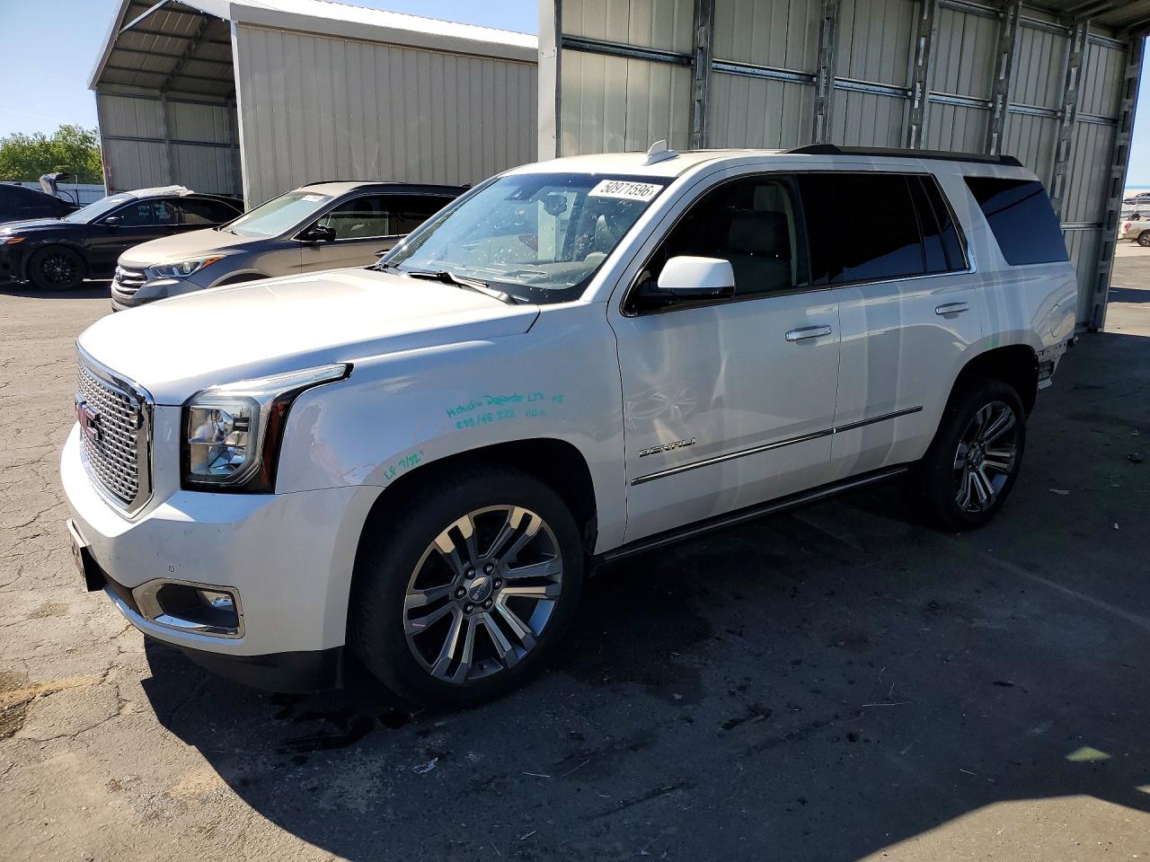 2017 GMC Yukon Denali, VIN 1GKS2CKJ5HR195437 — Rear end