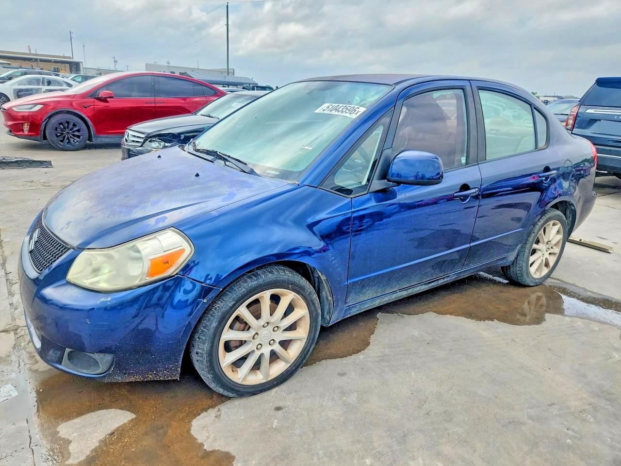 2011 Suzuki SX4 LE, VIN JS2YC5A29B6304473 — Side