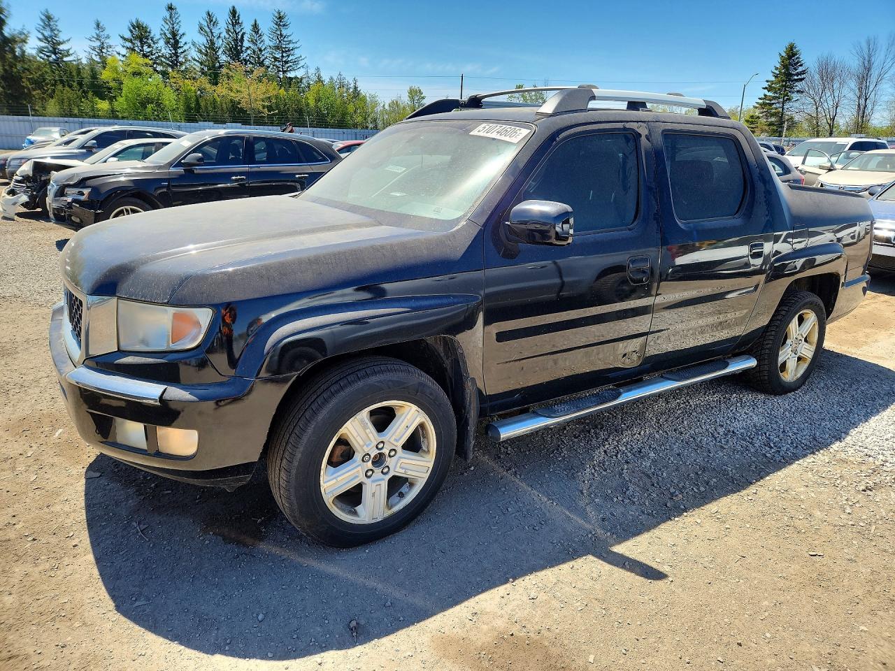 2011 Honda Ridgeline RTL, VIN 5FPYK1F58BB502157 — Rear end