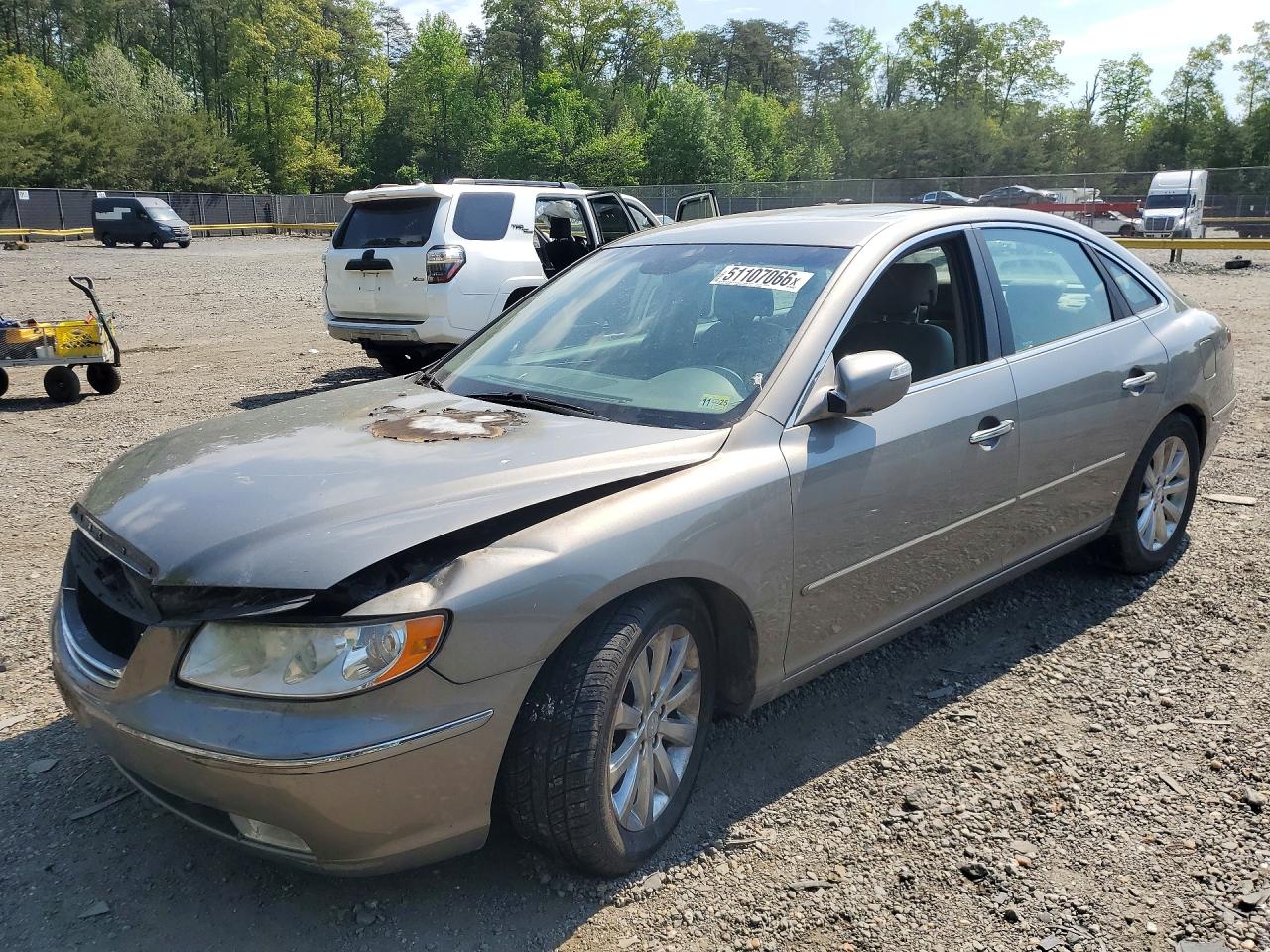 2010 Hyundai Azera Limited, VIN KMHFC4DF1AA451050 — Пожар в моторном отсеке