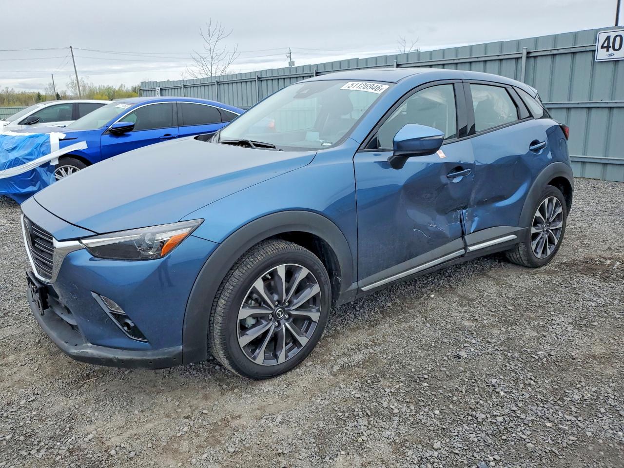 2019 Mazda CX-3 Grand Touring, VIN JM1DKFD76K1459245 — Side