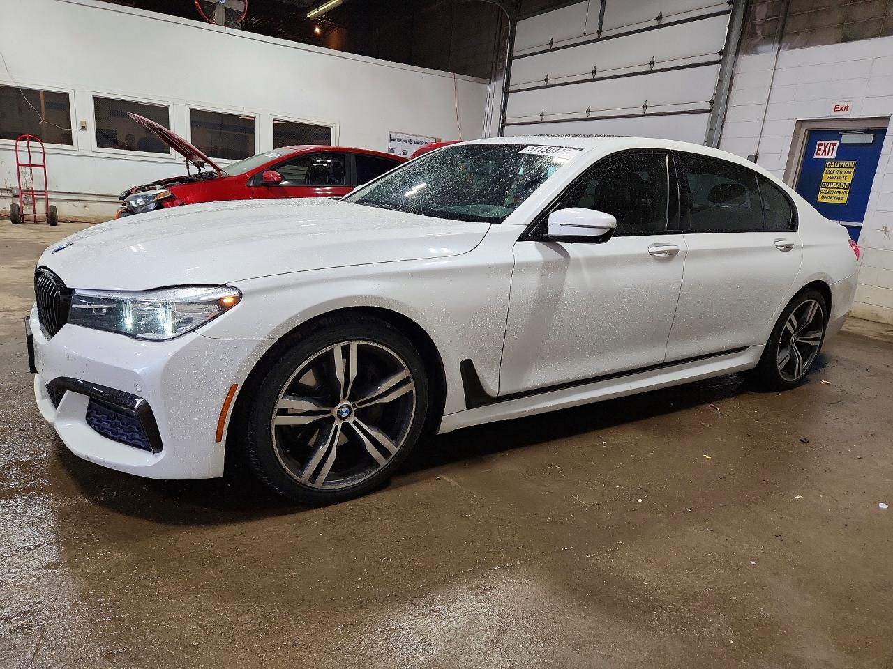 2016 BMW 7 Series 740i, VIN WBA7E2C57GG714497 — Side