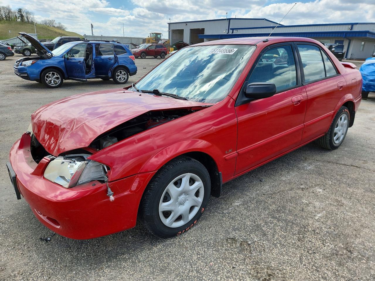 2000 Mazda Protege DX, VIN JM1BJ2221Y0217570 — Front end