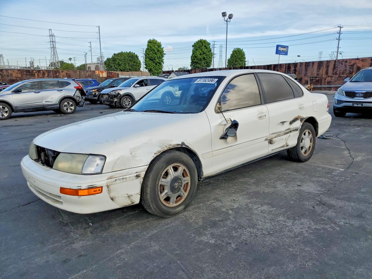 1995 Toyota Avalon XLS, VIN 4T1GB11E7SU056047 — Side