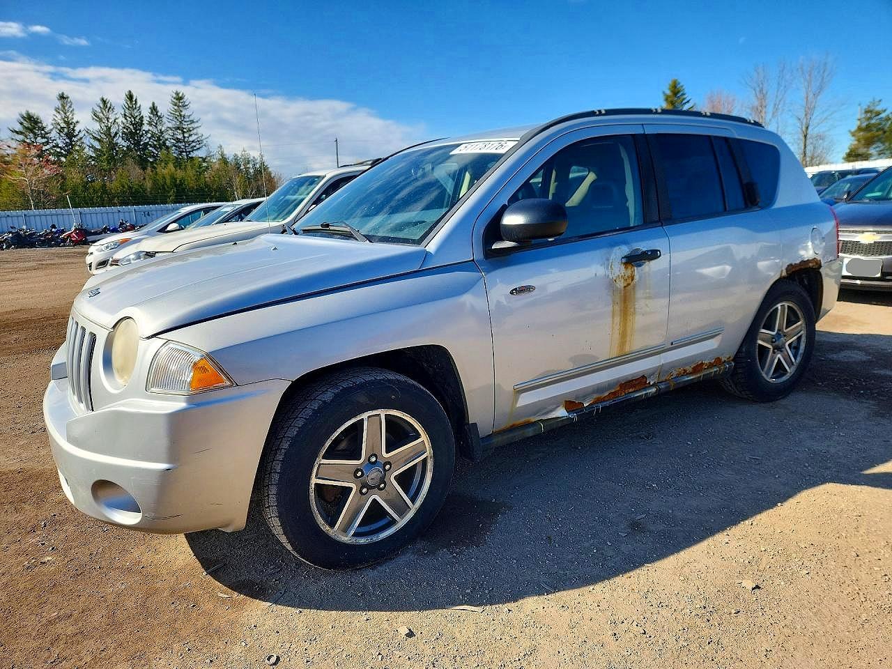 2009 Jeep Compass Sport, VIN 1J4FF47B69D230665 — Side