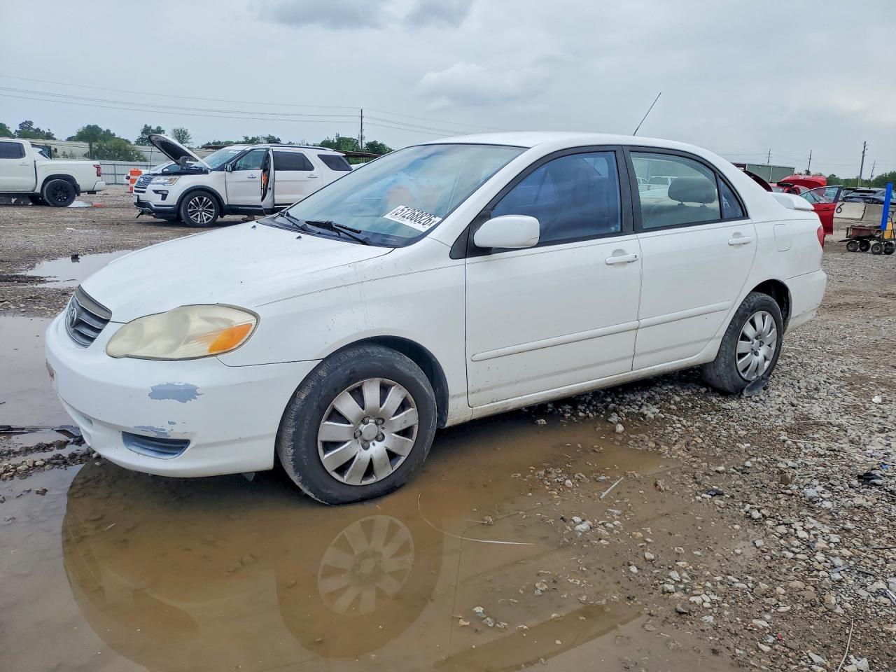 2004 Toyota Corolla CE, VIN 1NXBR32E74Z302257 — Side