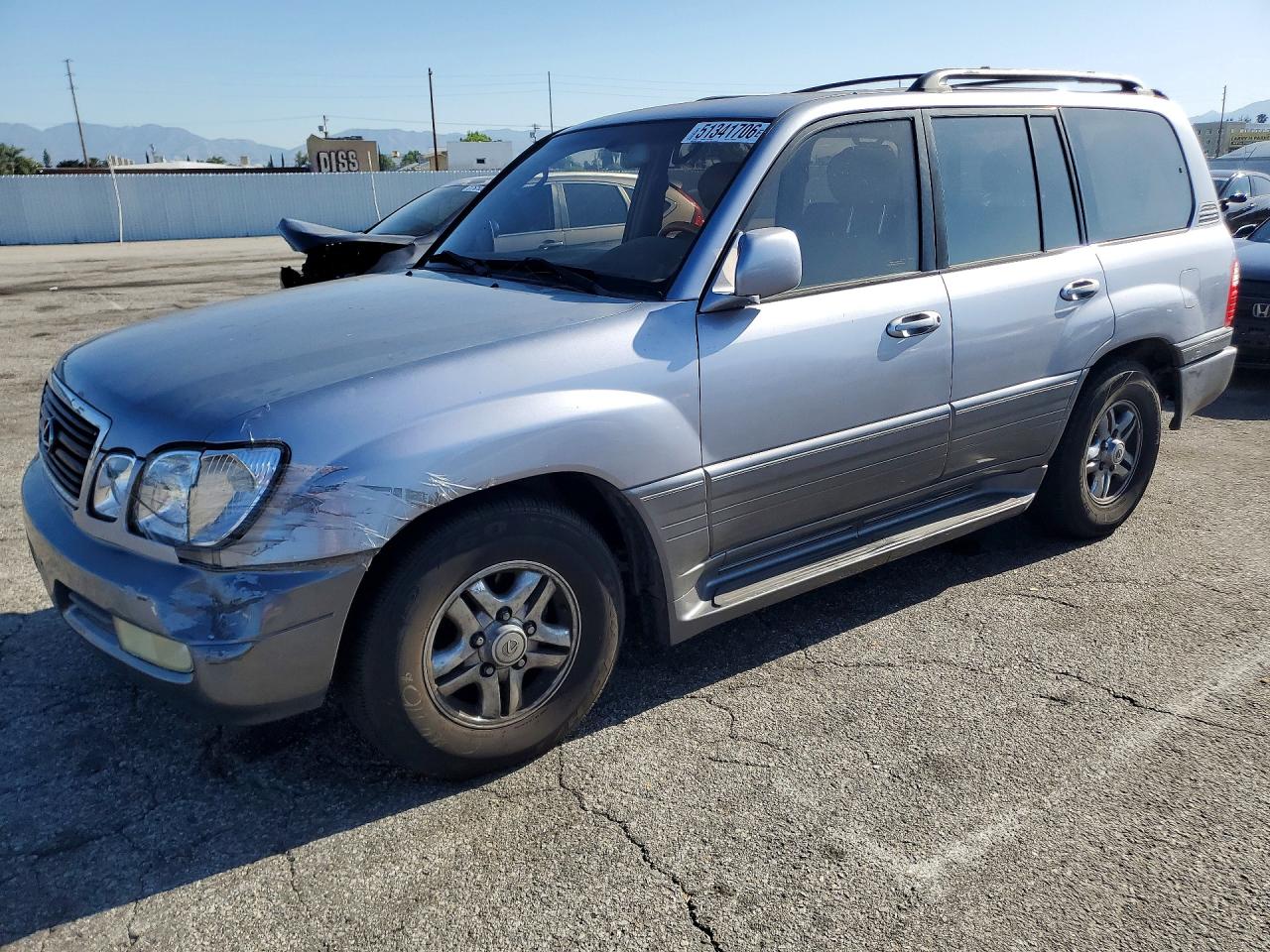 2001 Lexus LX 470, VIN JTJHT00W813503786 — Side