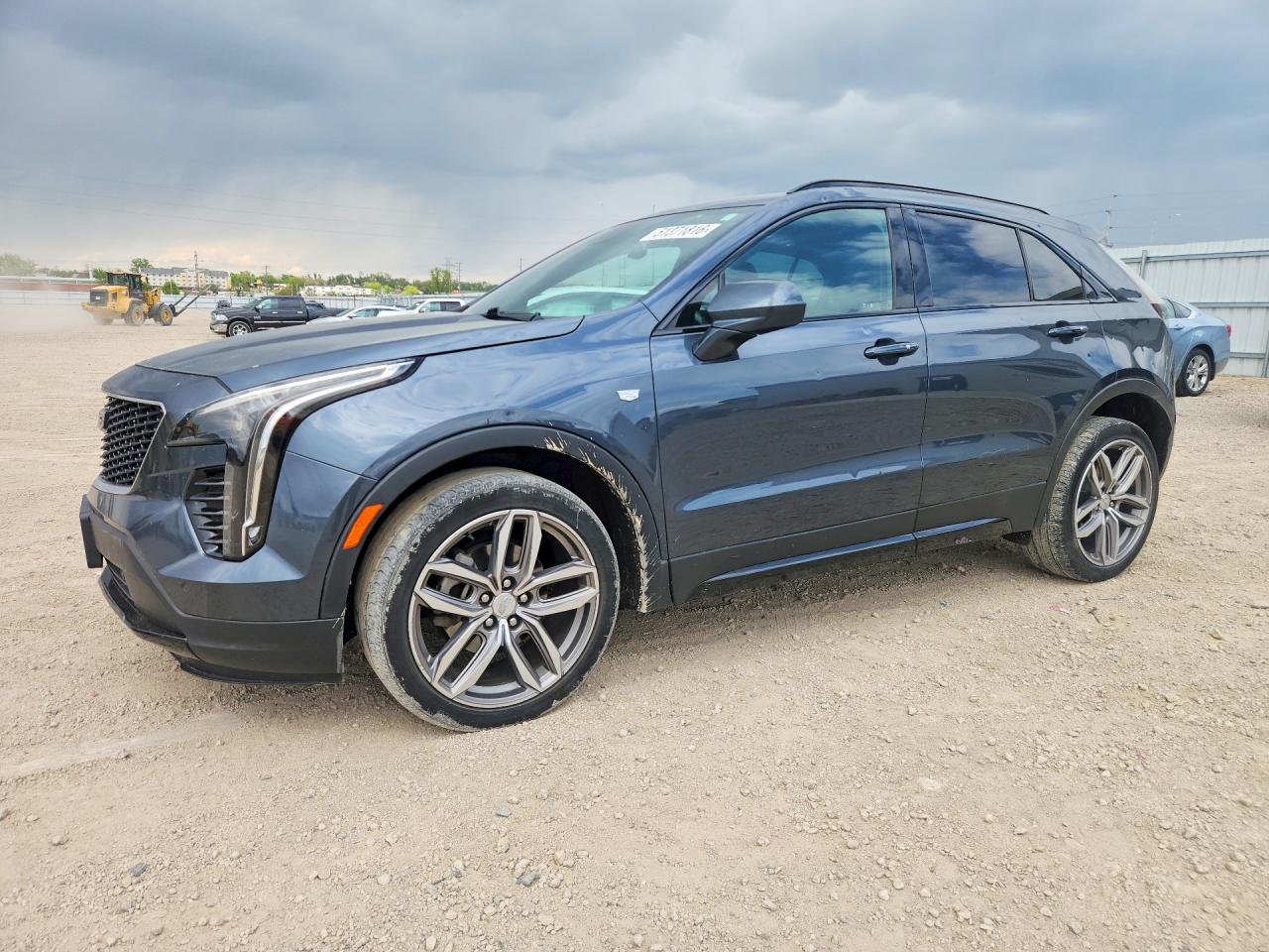 2019 Cadillac XT4 AWD Sport, VIN 1GYFZFR41KF102040 — Hail