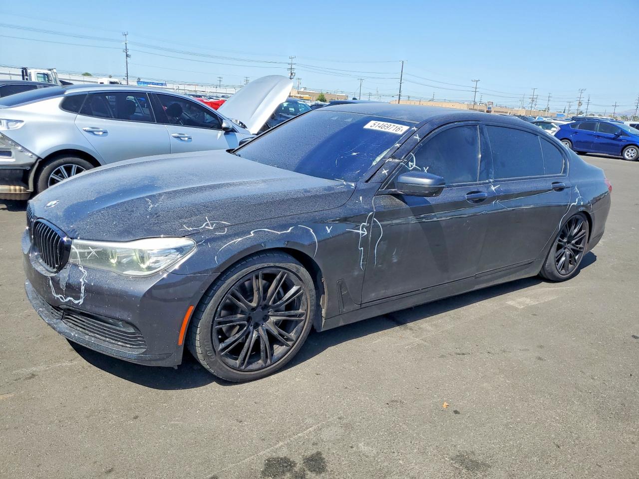 2016 BMW 7 Series 740i, VIN WBA7E2C56GG547050 — Side