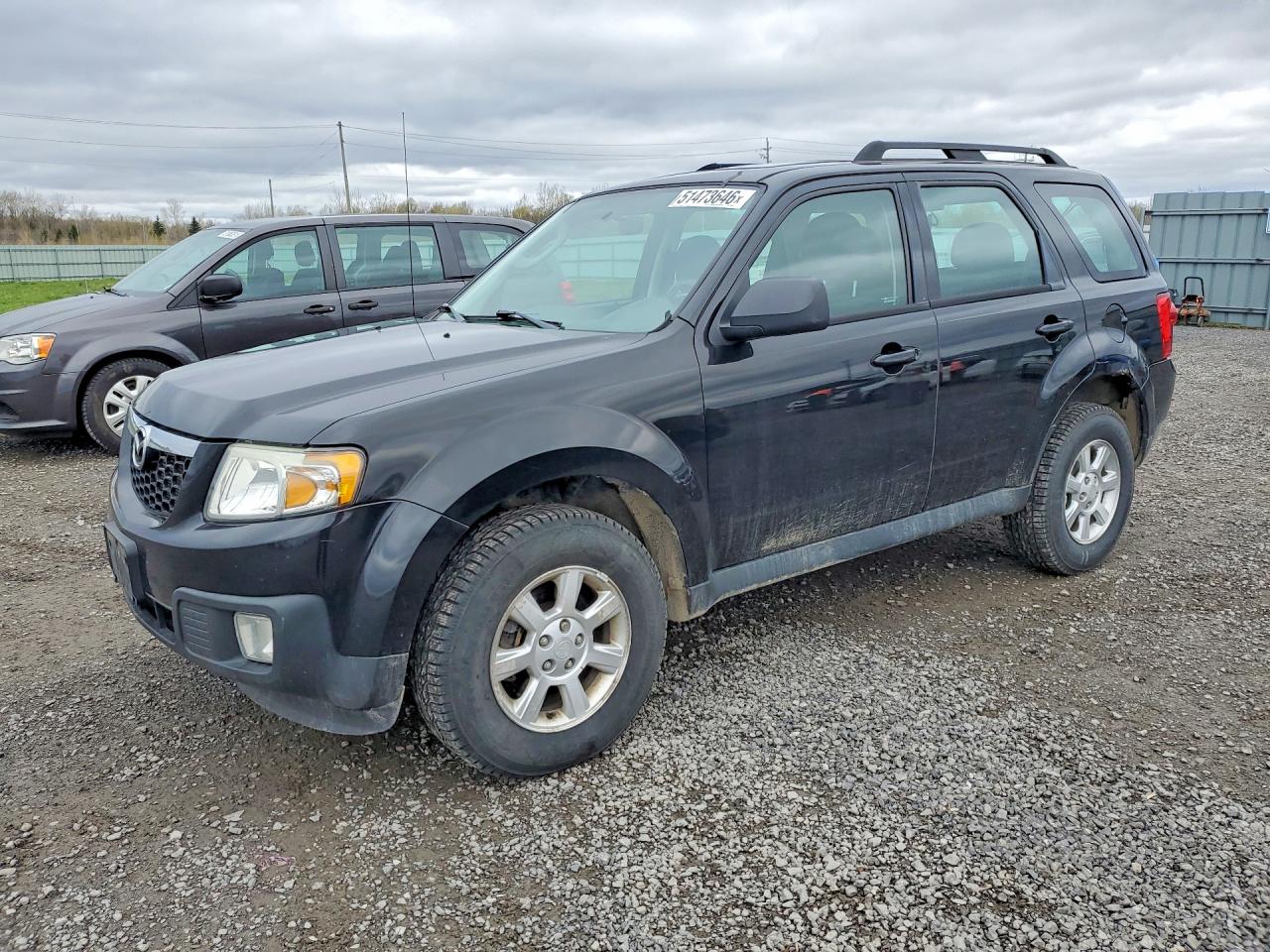 2011 Mazda Tribute Touring, VIN 4F2CY9C7XBKM01954 — Minor dents and scratches
