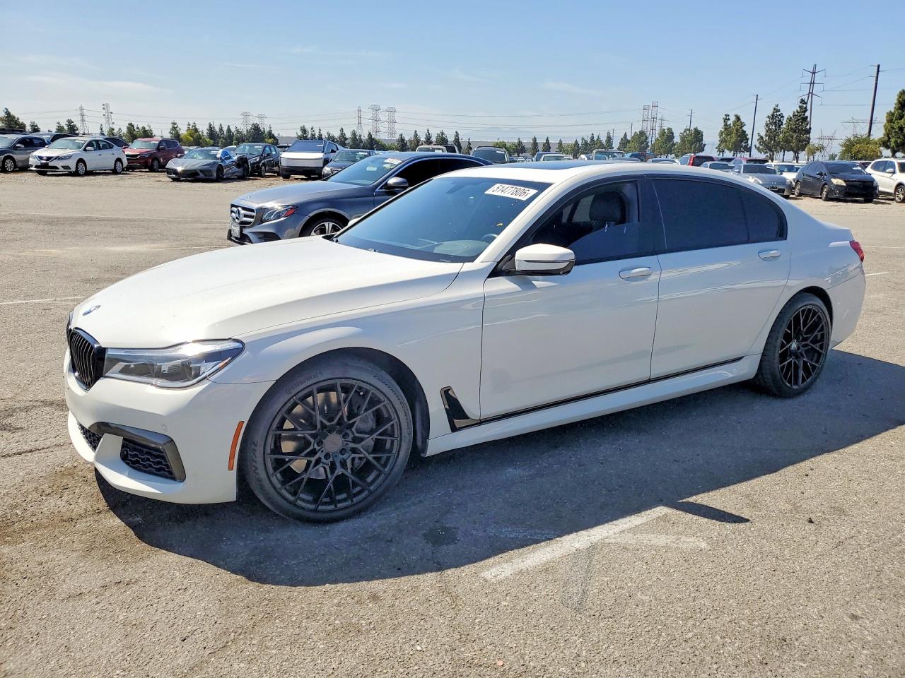2016 BMW 7 Series 750i xDrive, VIN WBA7F2C55GG415510 — Side