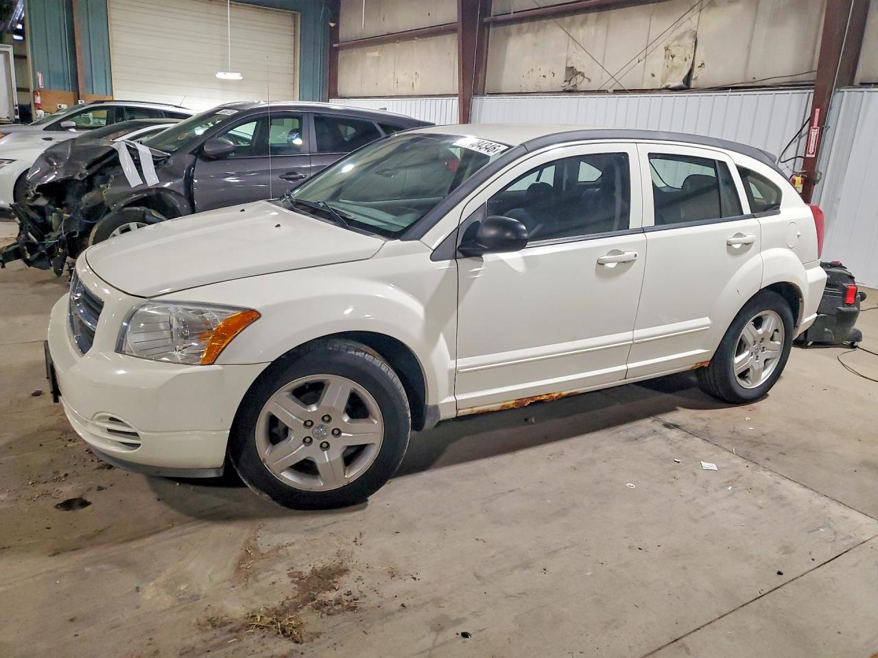 2009 Dodge Caliber SXT, VIN 1B3HB48A09D147850 — Мелкие вмятины и царапины