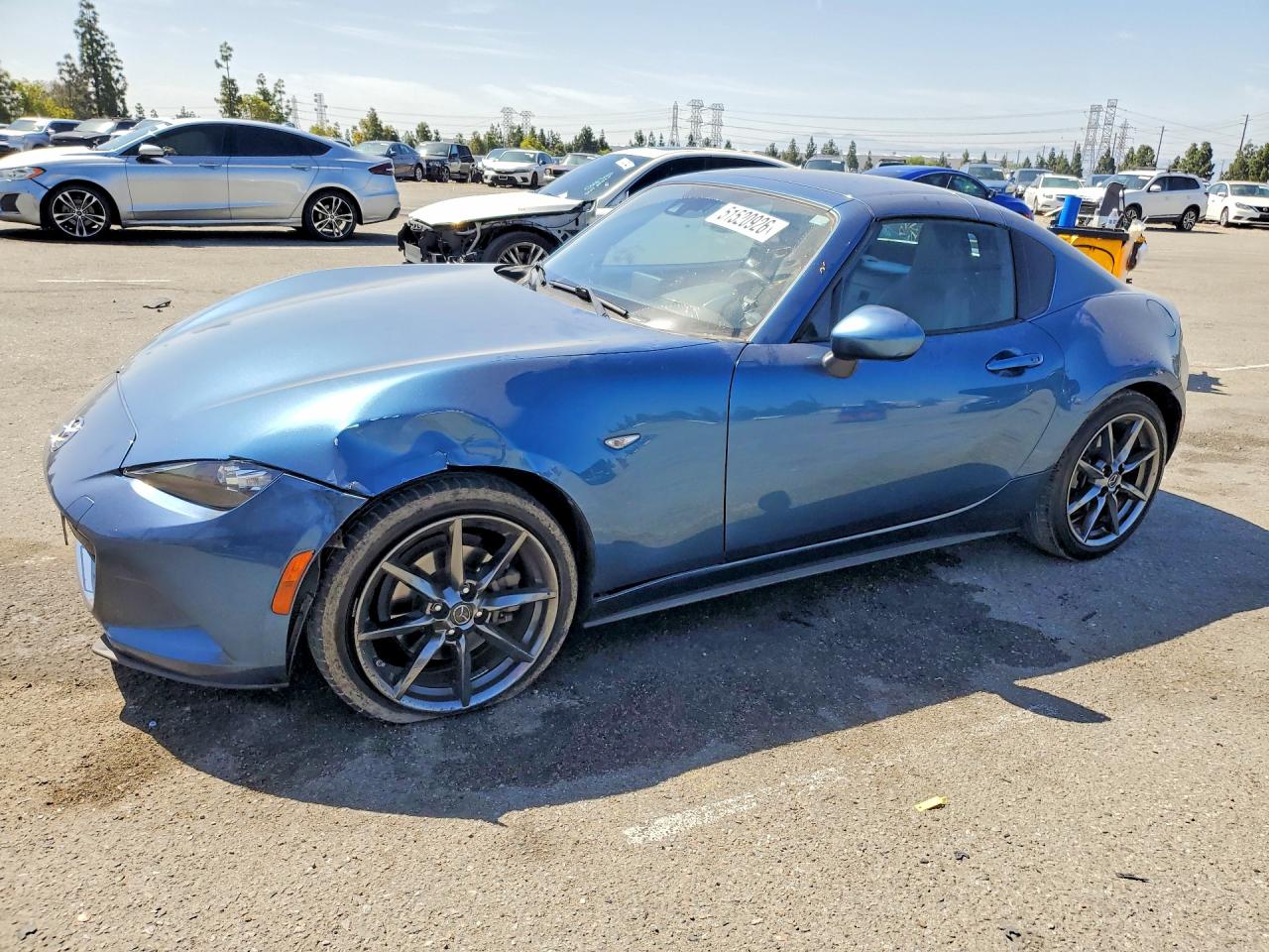 2018 Mazda MX-5 Miata Grand Touring, VIN JM1NDAM72J0205747 — Side
