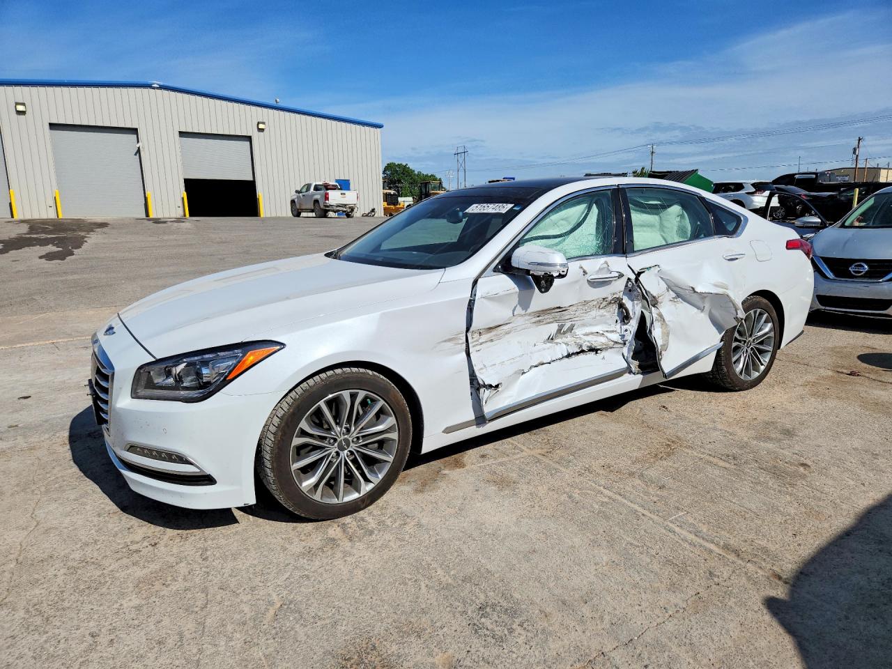 2017 Genesis G80 3.8L, VIN KMHGN4JE3HU206883 — Side