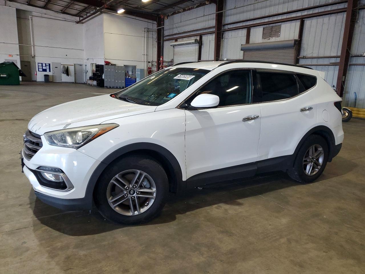 2017 Hyundai Santa Fe 2.4L, VIN 5XYZU3LB2HG422397 — Side
