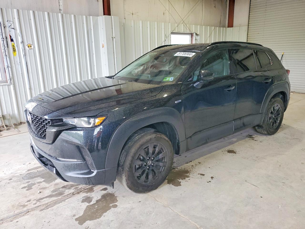 2025 Mazda CX-50 Hybrid Premium Package, VIN 7MMVAADW0SN105313 — Side