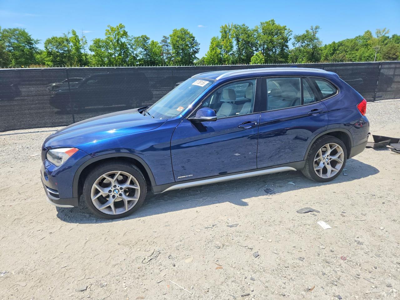 2015 BMW X1 xDrive28i, VIN WBAVL1C52FVY31289 — Rear end