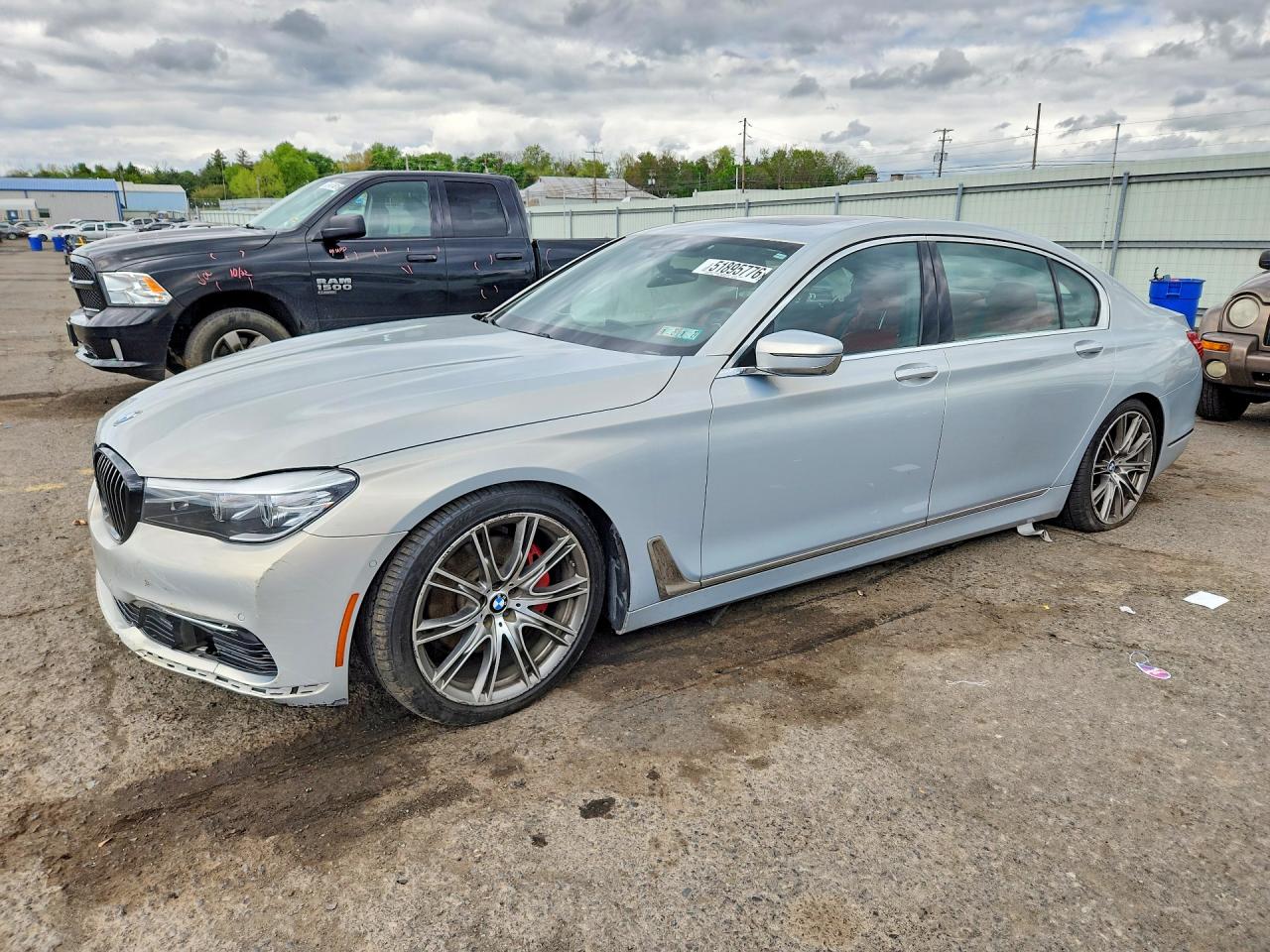 2016 BMW 7 Series 740i, VIN WBA7E2C50GG739080 — Side