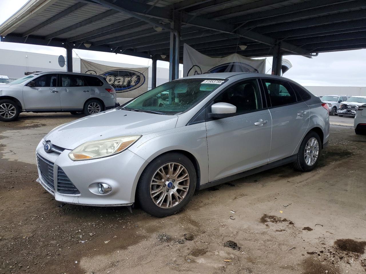 2012 Ford Focus SE, VIN 1FAHP3F22CL142321 — Side