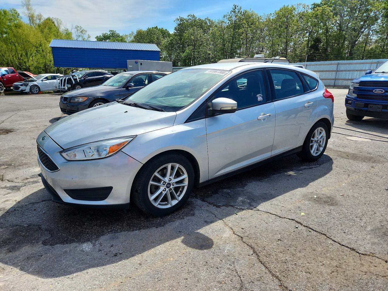 2016 Ford Focus SE, VIN 1FADP3K23GL372413 — Hail