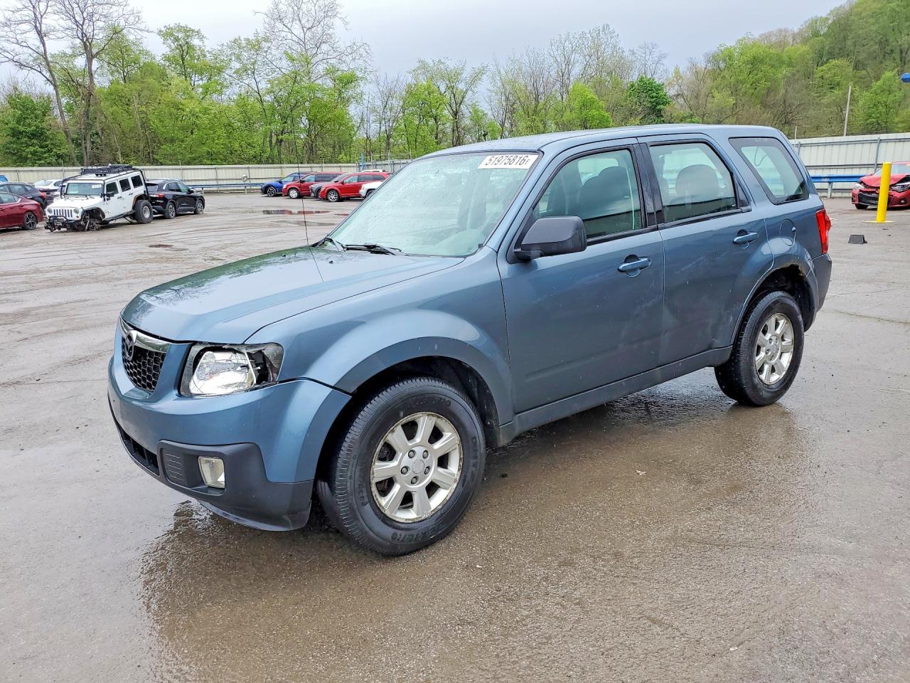 2011 Mazda Tribute Touring, VIN 4F2CY9C73BKM00743 — Бок