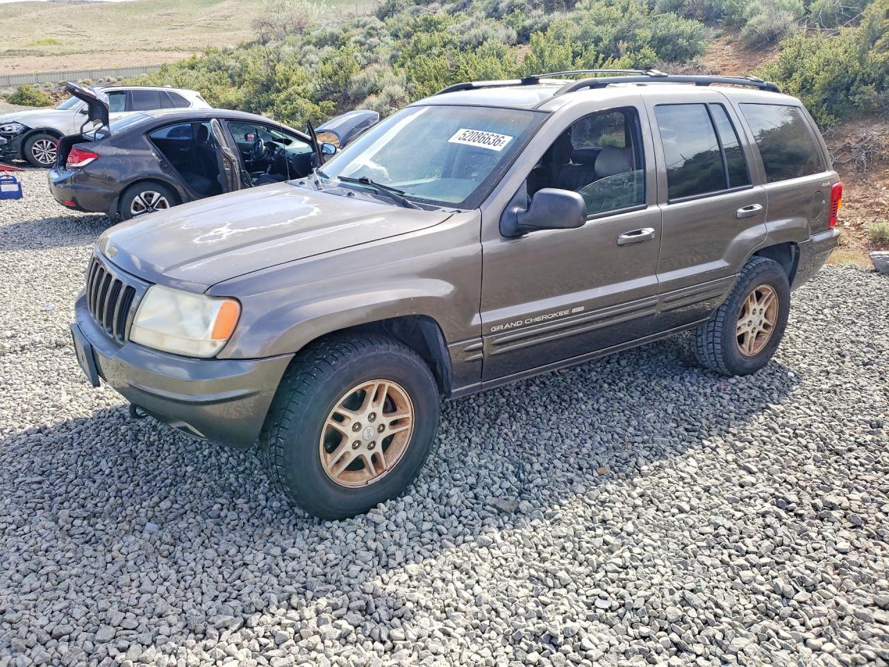 1999 Jeep Grand Cherokee Limited, VIN 1J4GW68N2XC677361 — Minor dents and scratches
