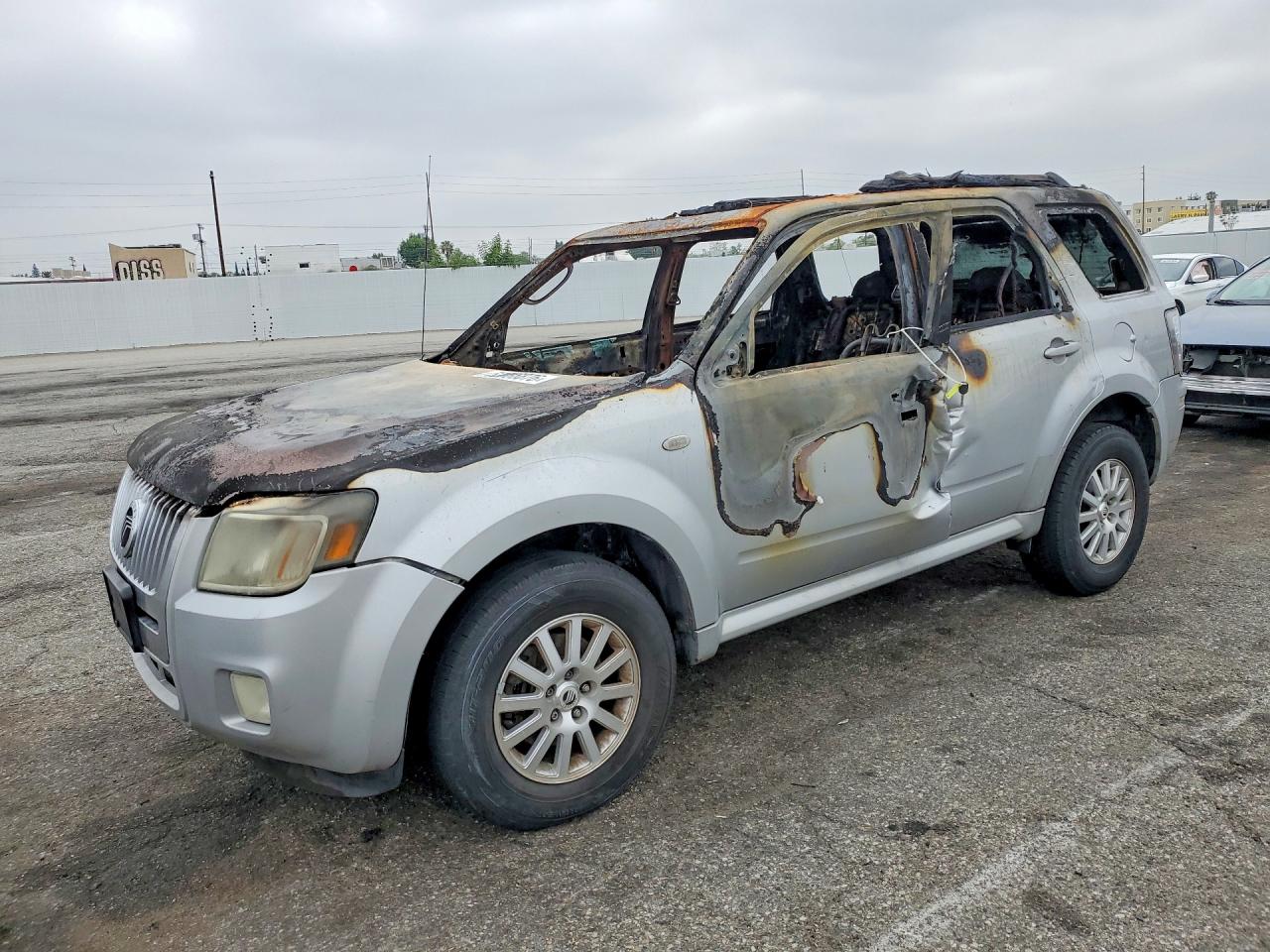 2009 Mercury Mariner Premier, VIN 4M2CU87G89KJ09319 — Burn