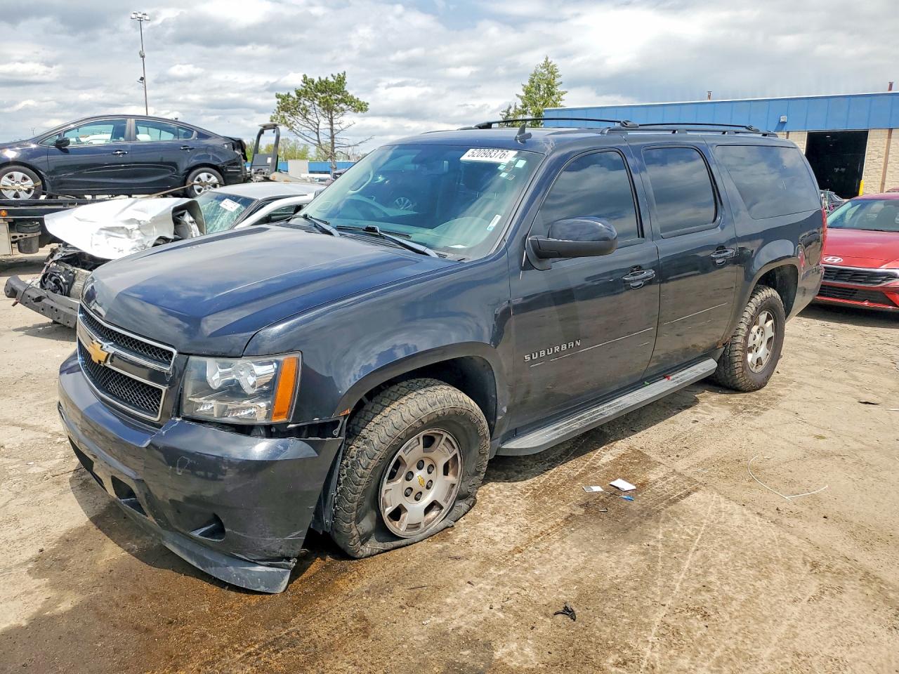 2012 Chevrolet Suburban LS, VIN 1GNSKHE78CR236670 — Front end