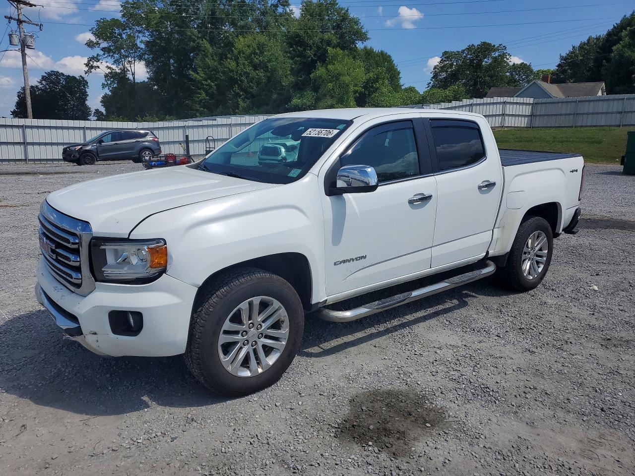 2016 GMC Canyon 4WD SLT, VIN 1GTG6DE37G1216732 — Side
