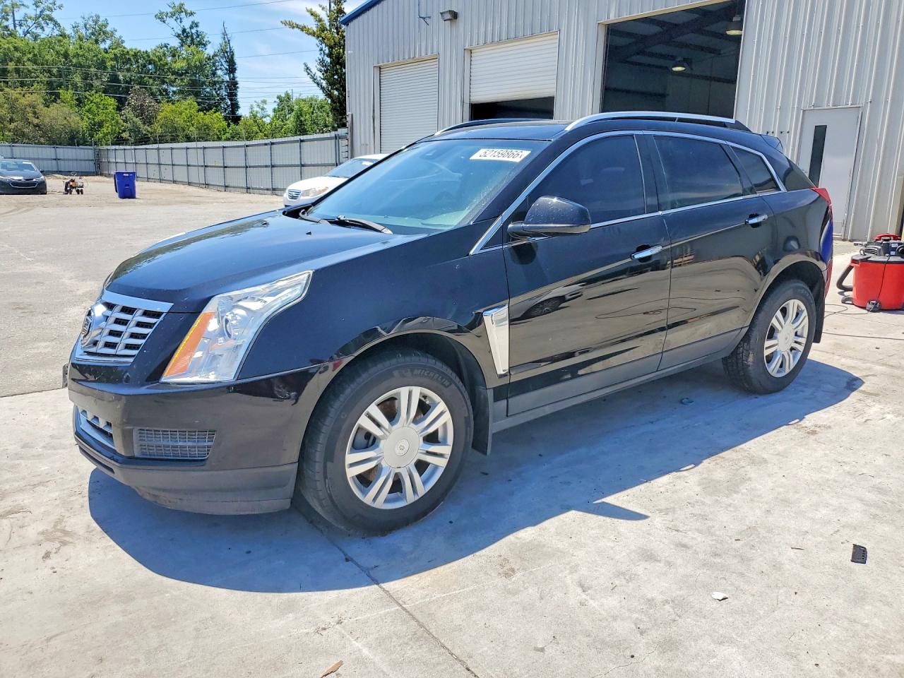 2016 Cadillac SRX Luxury Collection, VIN 3GYFNBE37GS508036 — Front end