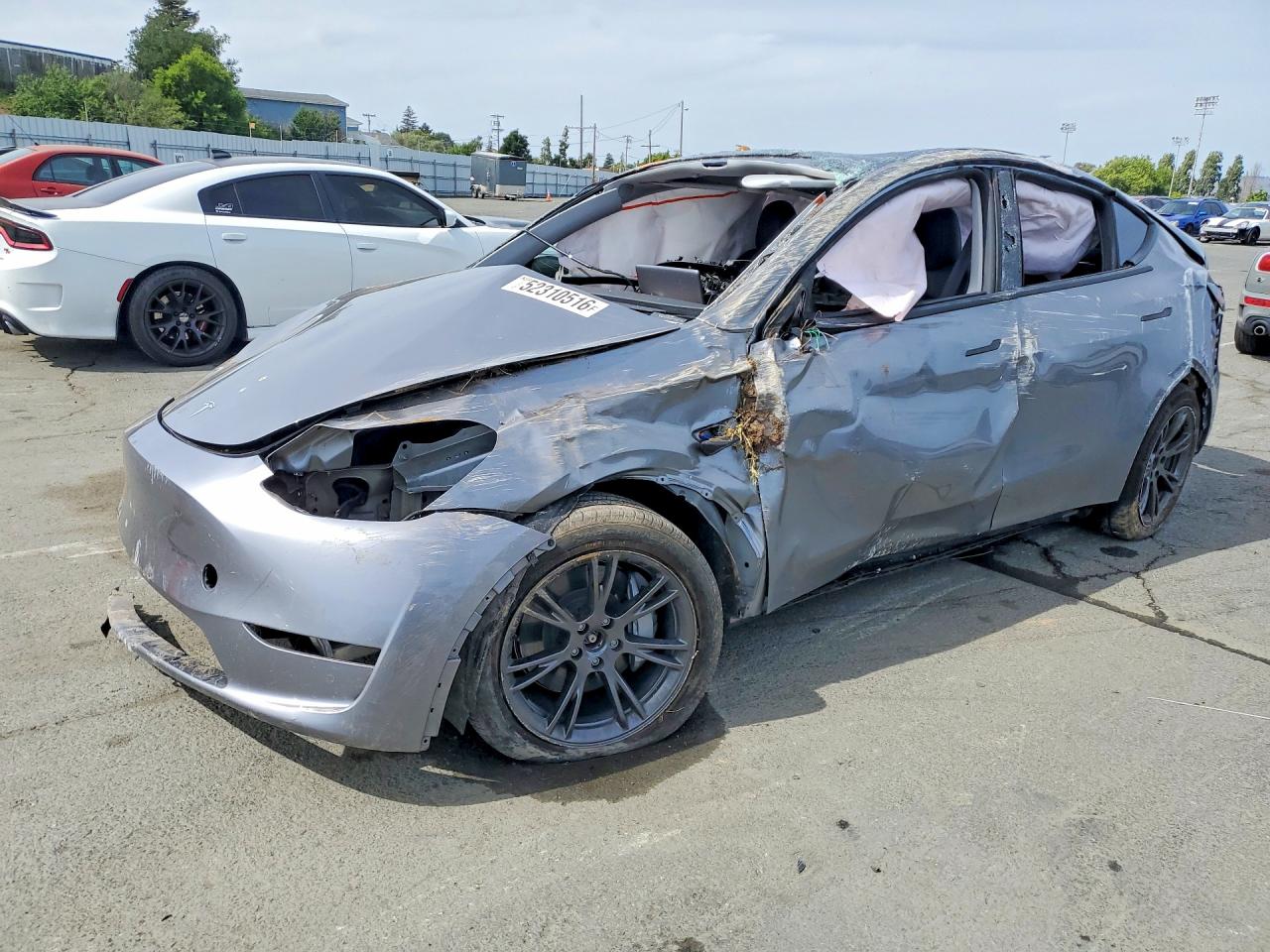 2025 Tesla Model Y Long Range, VIN 7SAYGDEE8SF263595 — Rollover