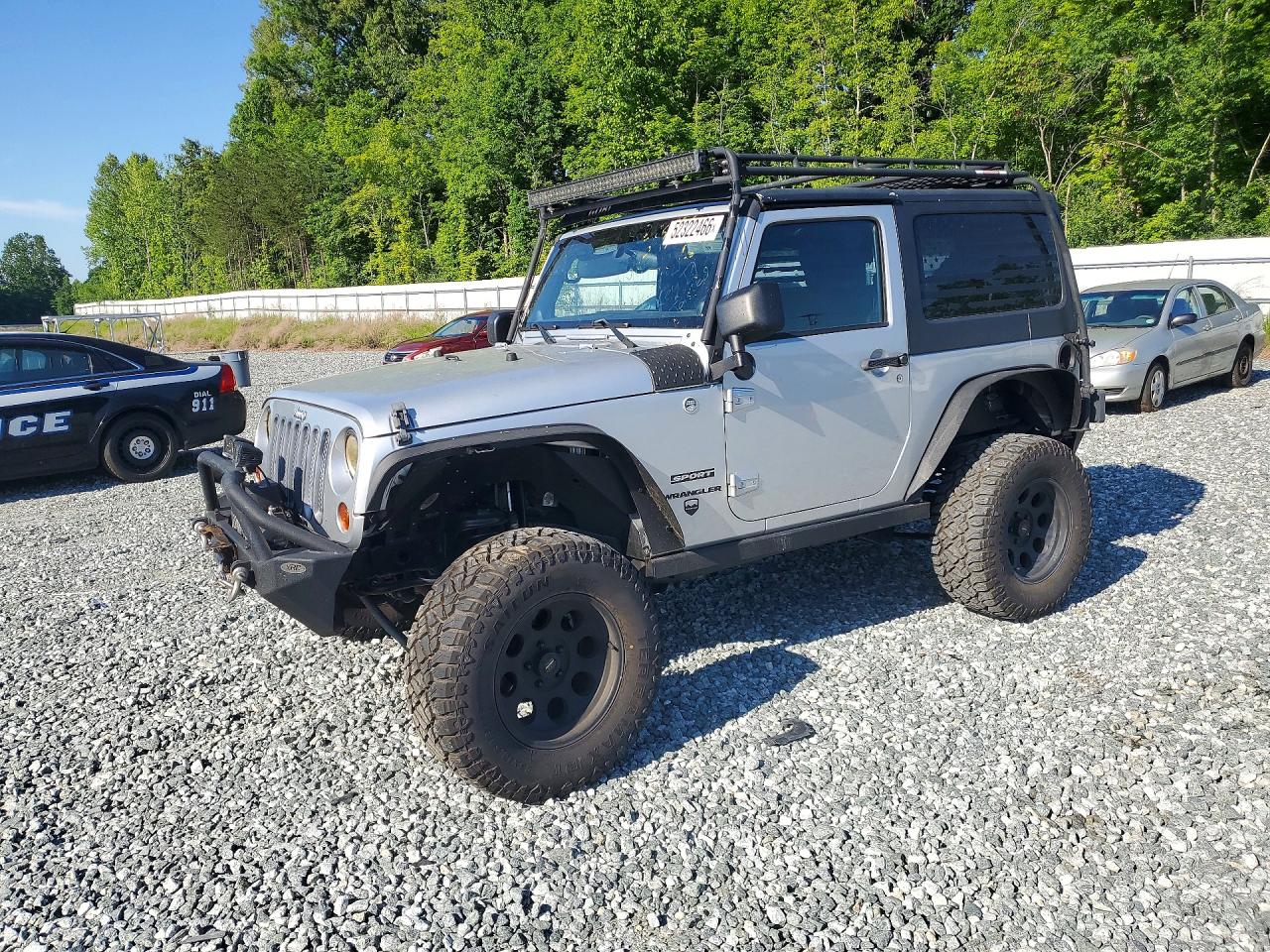 2012 Jeep Wrangler Sport, VIN 1C4AJWAG6CL273575 — Front end