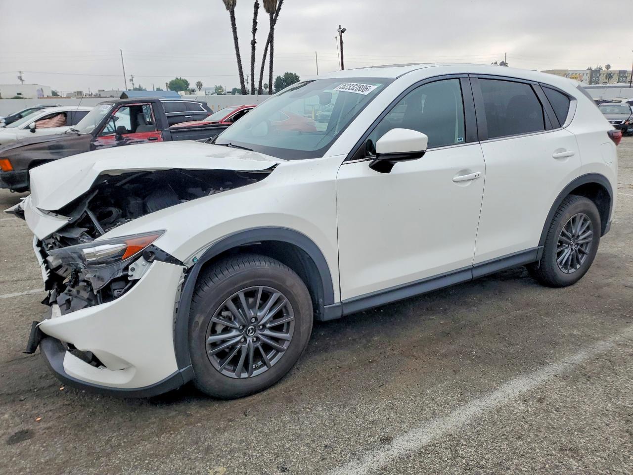 2021 Mazda CX-5 Touring, VIN JM3KFACM7M0413266 — Front end