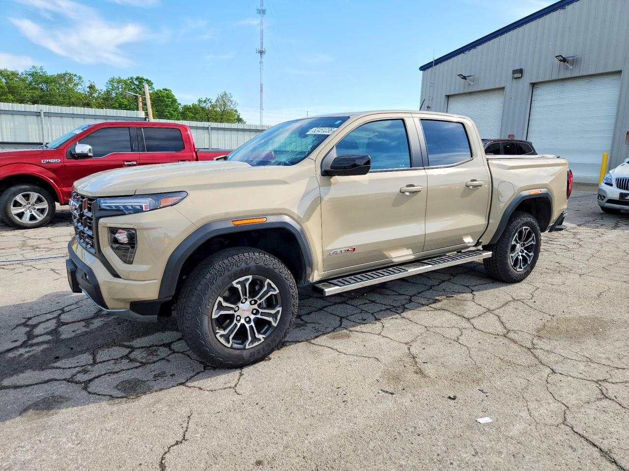 2023 GMC Canyon 4WD AT4, VIN 1GTP6DEK7P1143501 — Hail