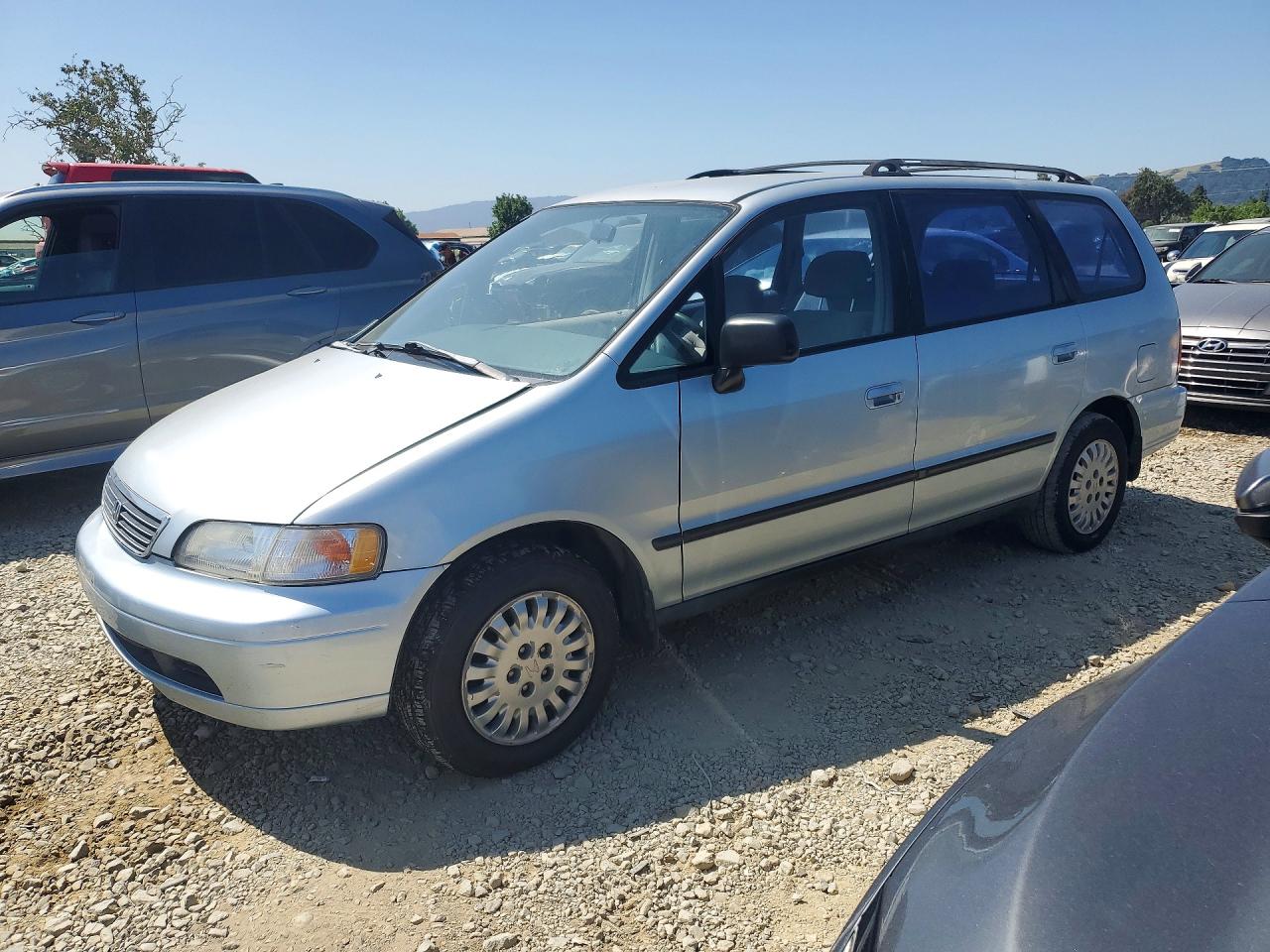 1997 Honda Odyssey LX, VIN JHMRA1861VC014562 — Side