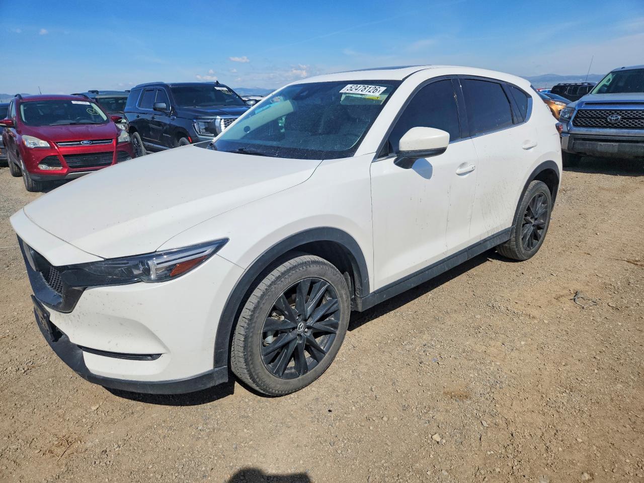2021 Mazda CX-5 Grand Touring Reserve, VIN JM3KFBAY7M0339701 — Side