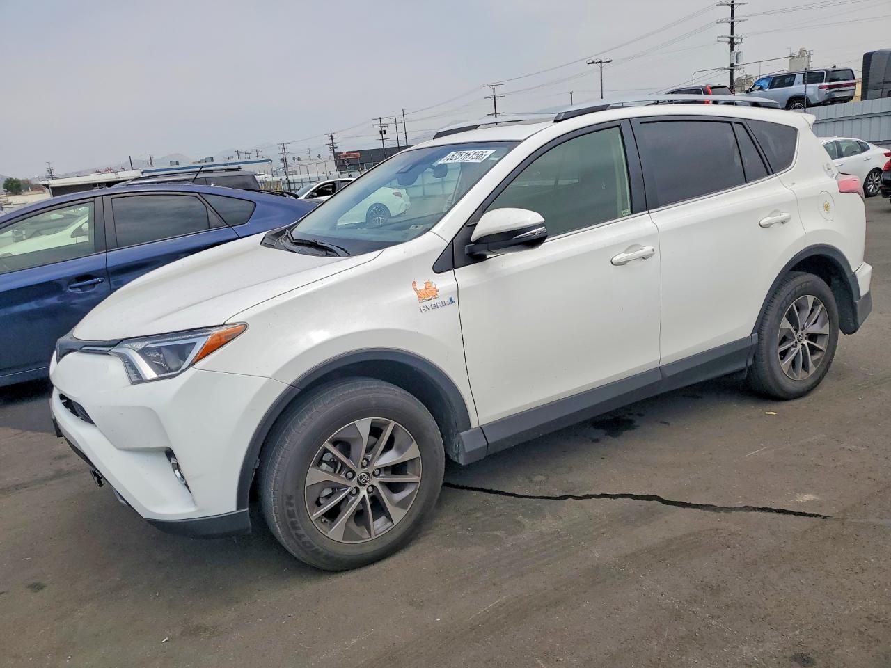 2018 Toyota RAV4 Hybrid XLE, VIN JTMRJREV7JD203054 — Rear end
