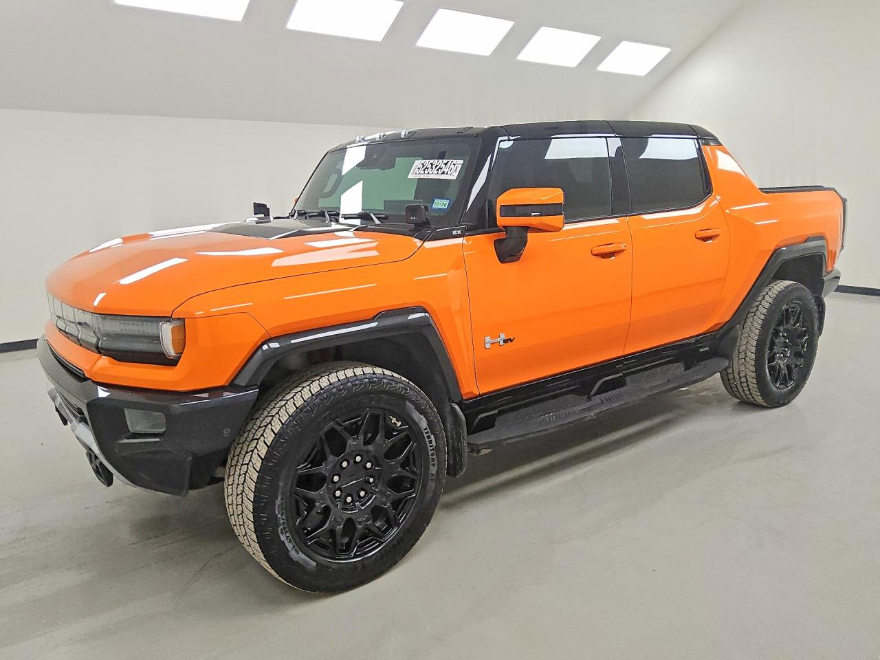 2024 GMC HUMMER EV Pickup 2X, VIN 1GT10BDD6RU104723 — Minor dents and scratches