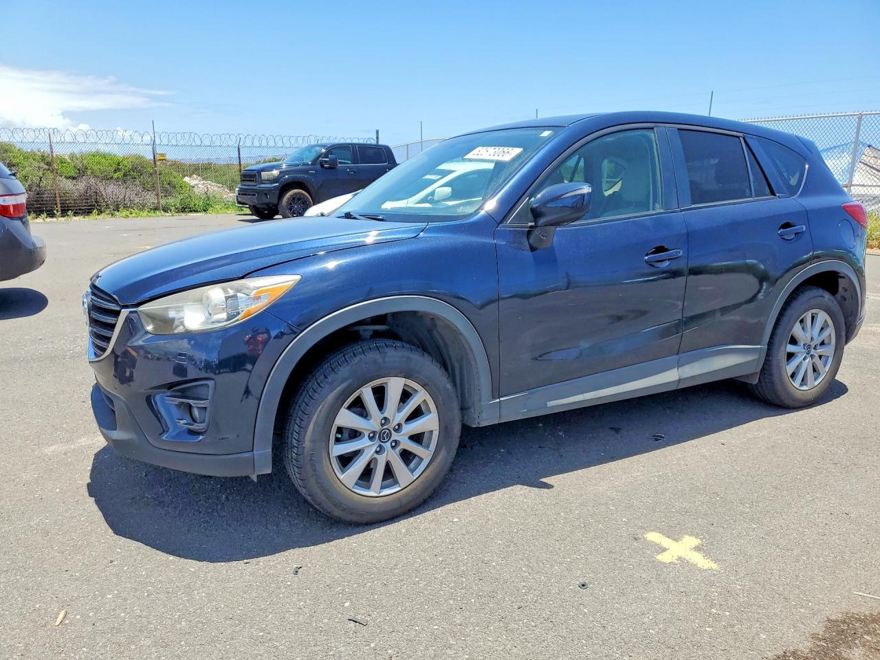 2016 Mazda CX-5 Touring, VIN JM3KE2CY0G0664453 — Rear end